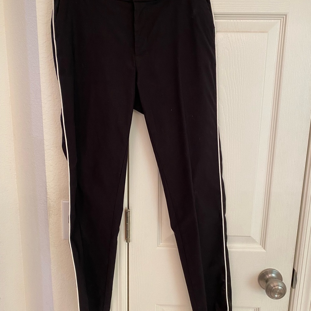 Time and Tru skinny pant. Size 4. Black with white sideline stripes.